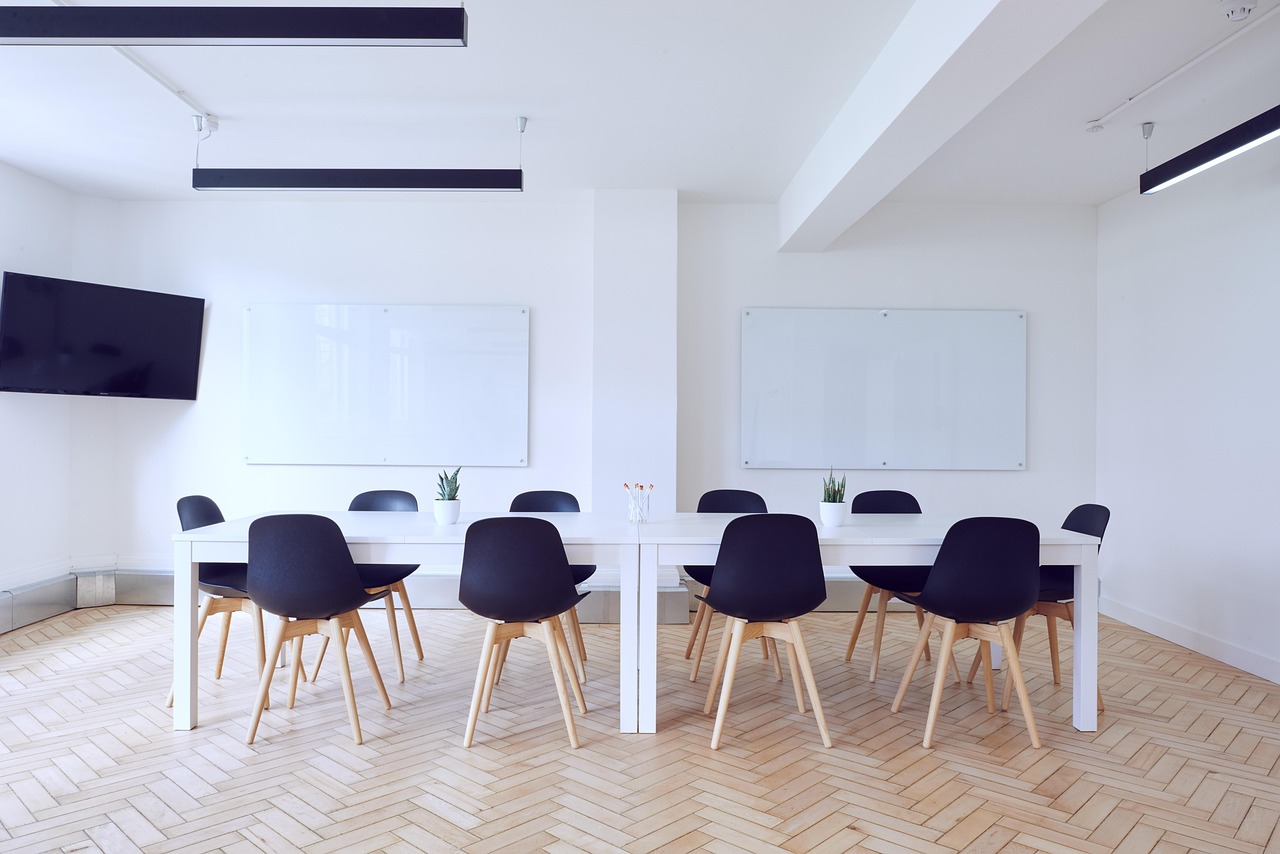 Professional trustee meeting boardroom discussion on scheme governance